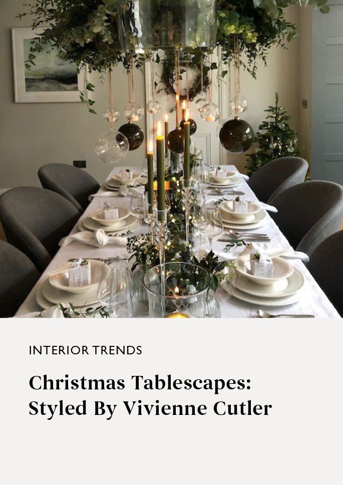 Dinner table with christmas decoration and green candles