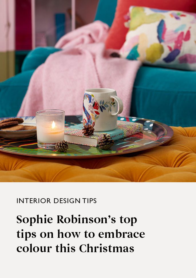Colourful Sofa with mug and candle
