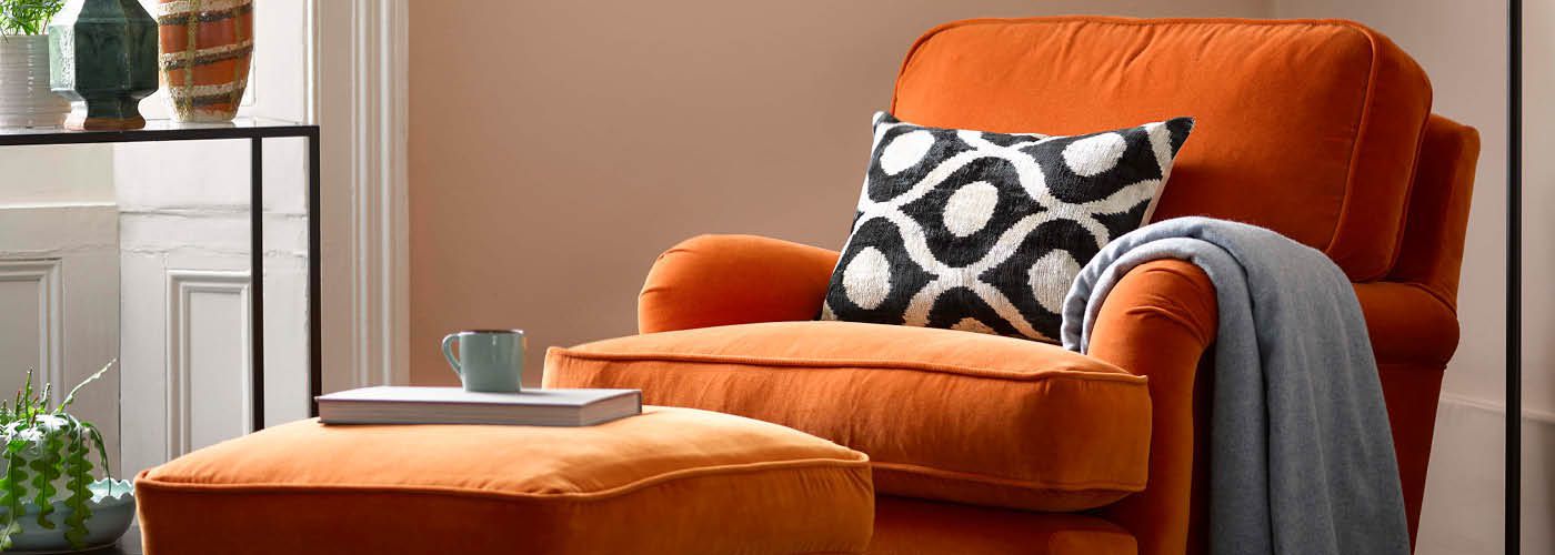 Orange Bluebell Armchair and footstool in living room