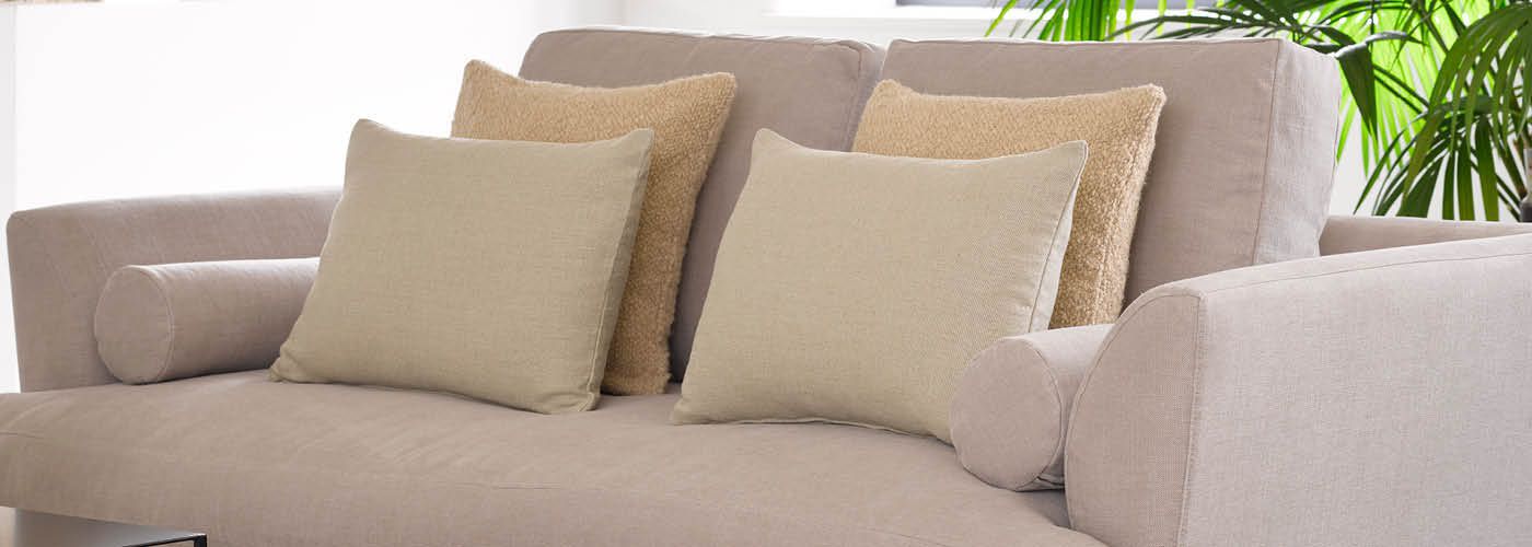 Fabric Scatter cushions on Sofa in furnished living room